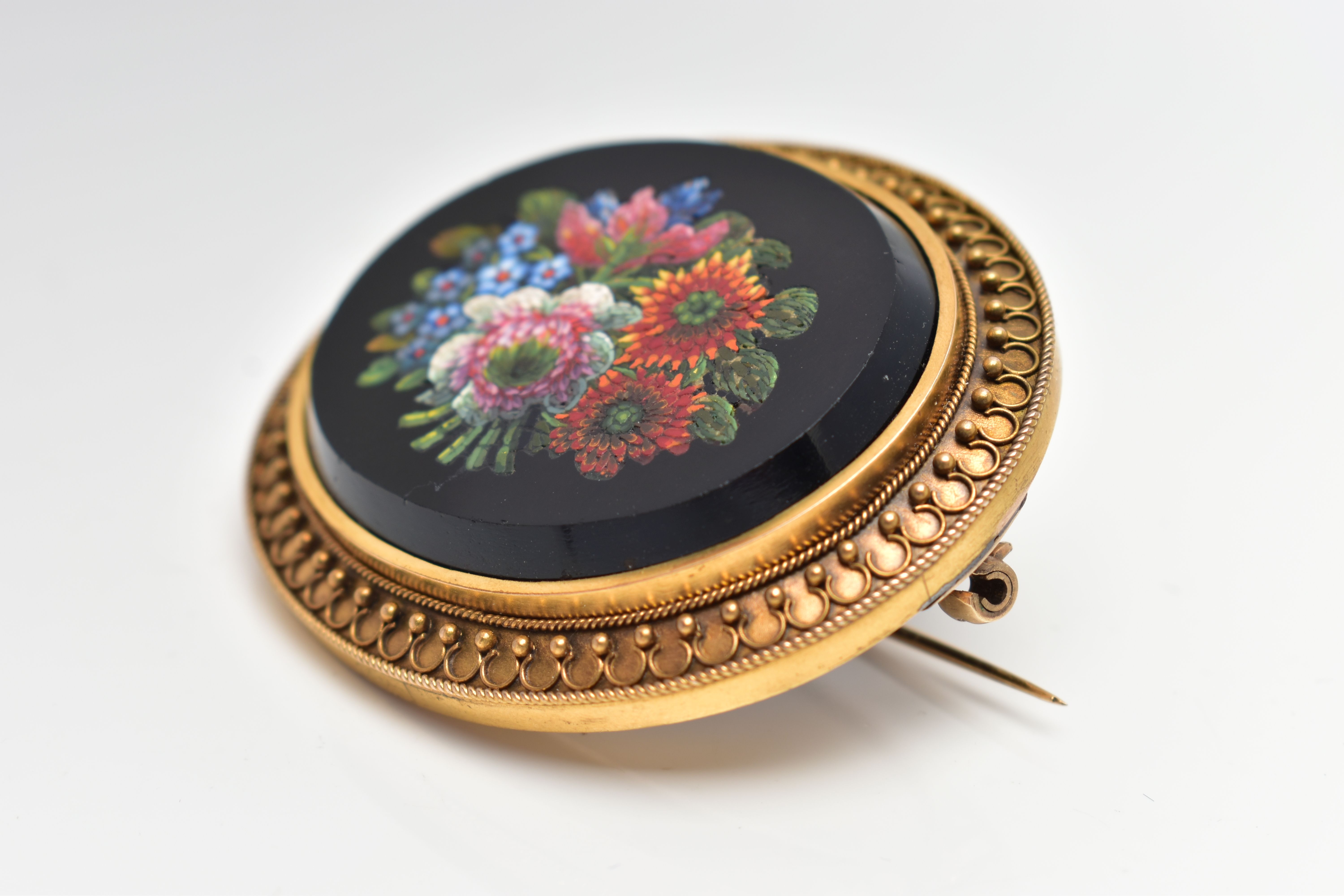 A VICTORIAN MICRO MOSAIC BROOCH, of an oval form, centering on an onyx oval inlay decorated with a - Image 4 of 4
