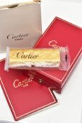 AN UNUSED GOLD PLATED 'CARTIER' LIGHTER, unopened gold plated textured lighter, signed to the