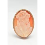 A 9CT GOLD CAMEO BROOCH, of an oval form, carved shell depicting a lady in profile, collet set to