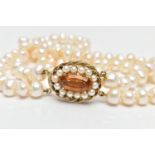 A CULTURED BAROQUE PEARL CHOKER NECKLACE, designed with two rows of baroque cultured pearls,