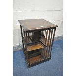 A 20TH CENTURY OAK TWO TIER REVOLVING BOOKCASE, 48cm x height 72cm, and an oak corner cupboard (