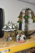 A GROUP OF THREE TIFFANY STYLE TABLE LAMPS, comprising a tall foliate and dragonfly lamp base with