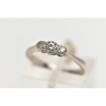 A WHITE METAL THREE STONE DIAMOND RING, to the centre sits a round brilliant cut diamond in an