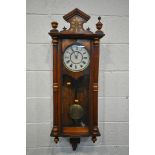 A LATE VICTORIAN WALNUT AND MARQUETRY INLAID VIENNA WALL CLOCK, with roman numerals, pendulum and