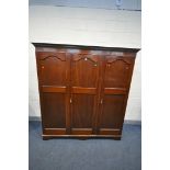 A 20TH CENTURY MAHOGANY TRIPLE DOOR WARDROBE, labelled J.Richardson & Sons, width 183cm x depth 61cm