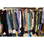 A QUANTITY OF VINTAGE AND MODERN LADIES CLOTHING, approximately eighty items of assorted ages from