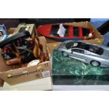 A MAISTO DIE CAST MODEL OF A JAGUAR XJ220, 1/12th scale complete with box and display stand,
