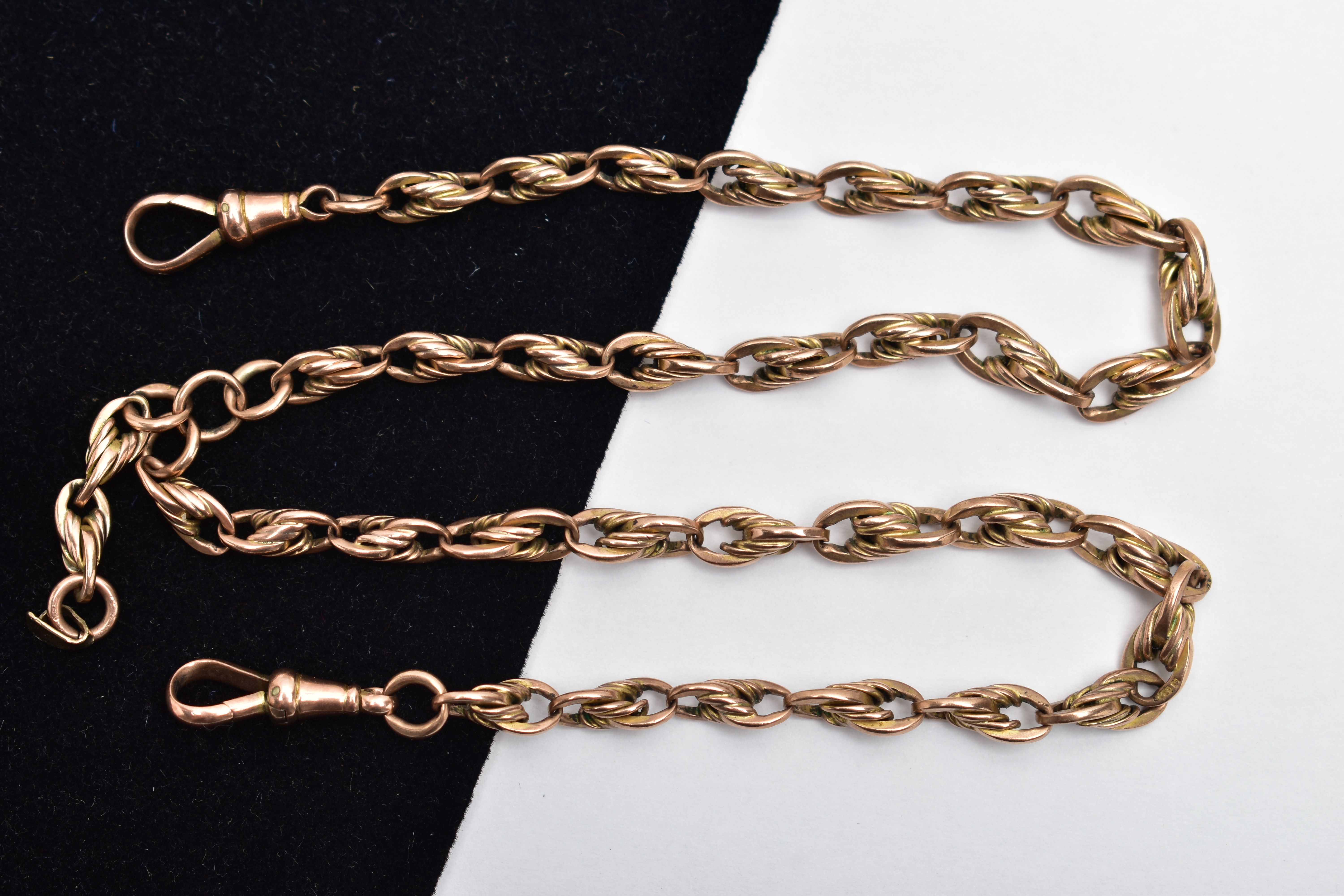 A ROSE TONE ALBERT CHAIN, of a rope twist and oval link design, most links stamped 9.375, fitted - Image 2 of 2