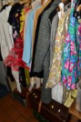 A GROUP OF VINTAGE CLOTHING, to include a dark brown fur coat, a 1960s pale blue Crimpolene suit,