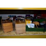 FOUR BOXES OF ASSORTED SUNDRIES AND BOOKS, to include two three tier cantilever wooden sewing boxes,