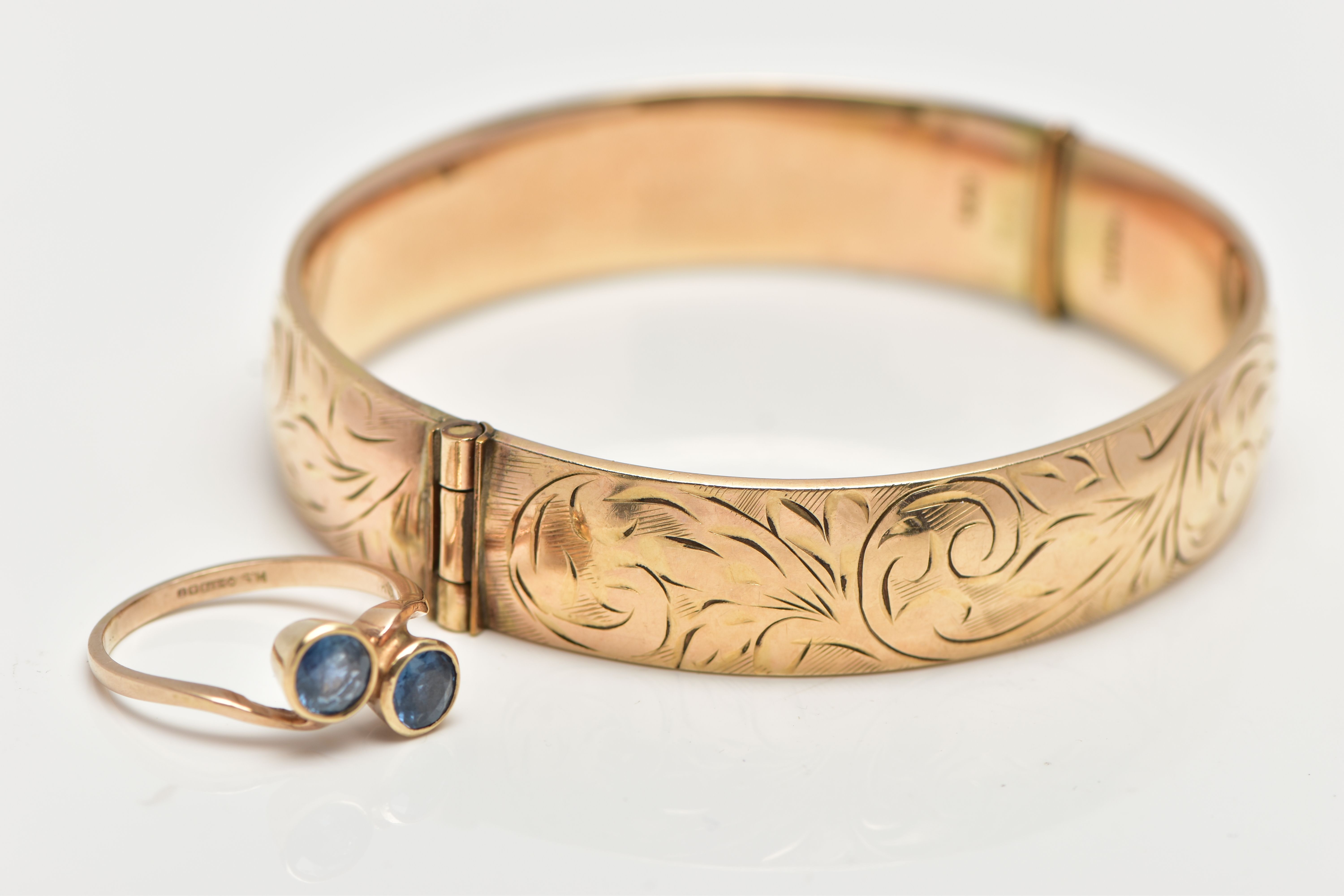 A 9CT GOLD SAPPHIRE RING AND A GOLD PLATED HINGED BANGLE, the ring of a cross over design, set - Image 3 of 4