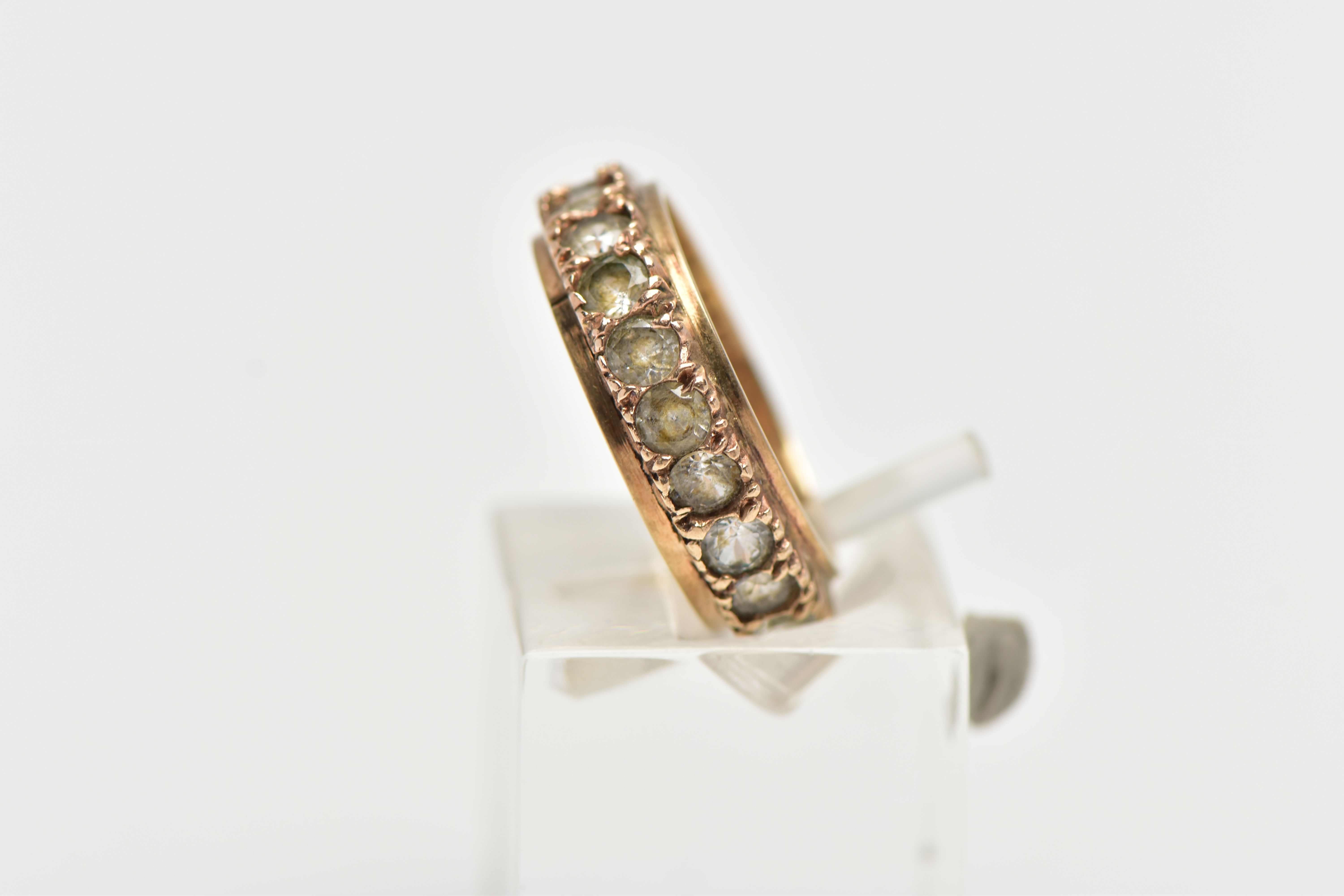 A YELLOW METAL FULL ETERNITY RING, set with a row of circular cut colourless stones assessed as - Image 2 of 4
