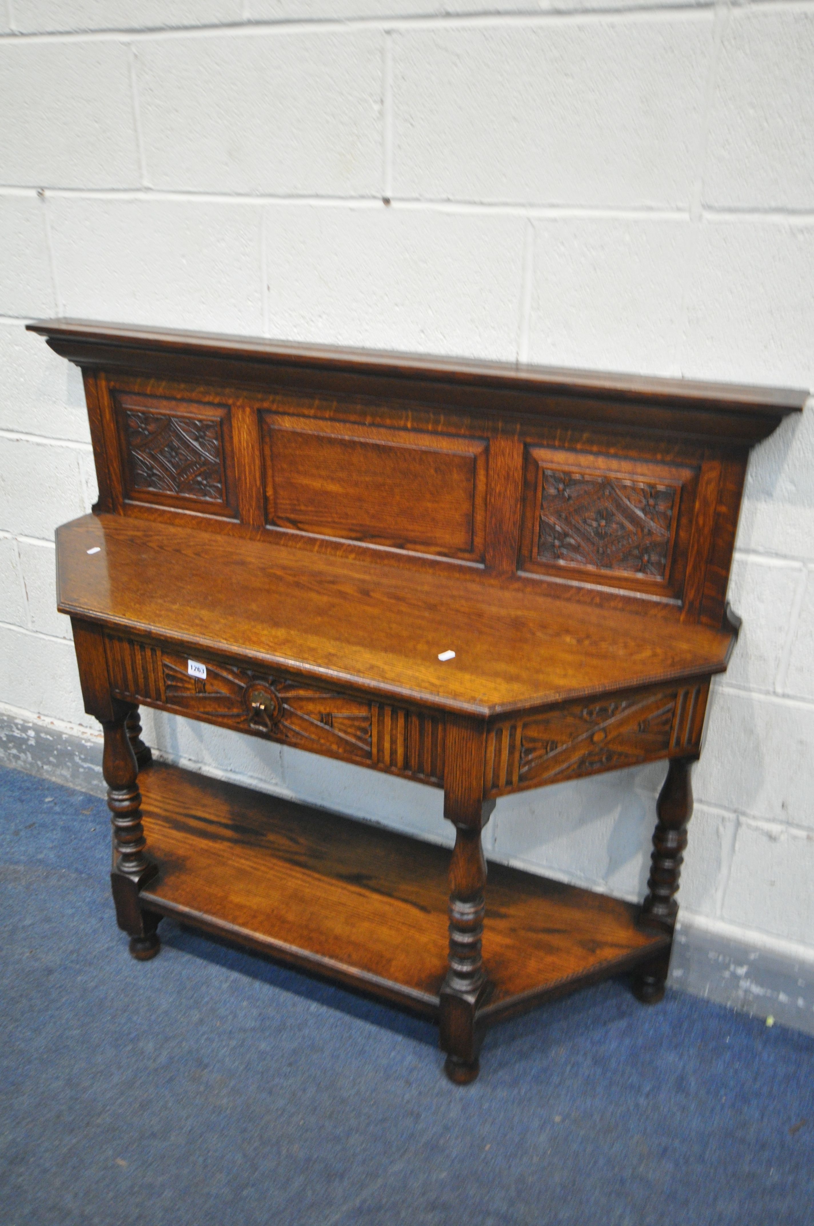 A 20TH CENTURY CANTED OAK SIDE TABLE, with a raised panelled back, a single frieze drawer, on turned - Image 2 of 4