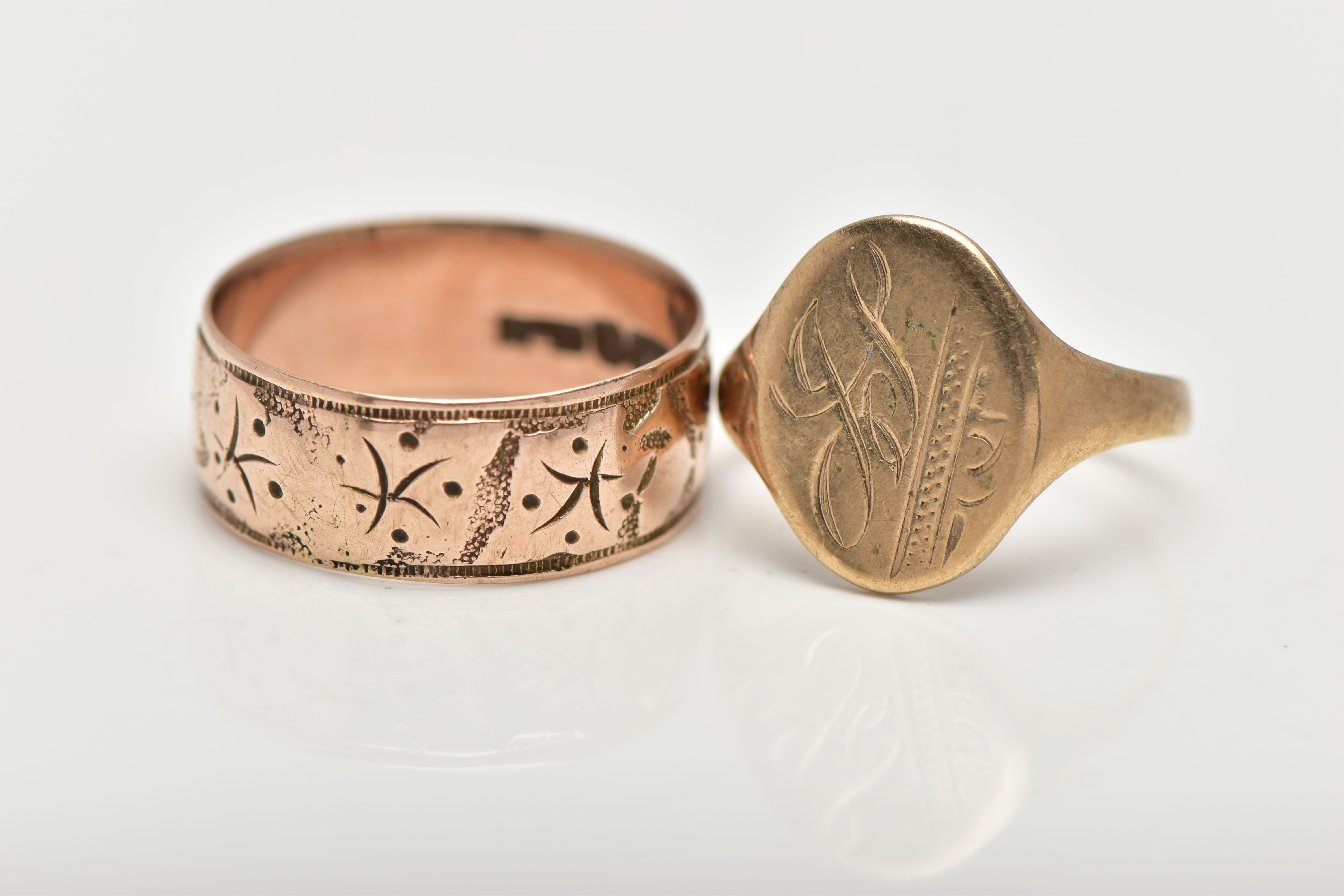 TWO 9CT GOLD RINGS, the first a wide band ring, engraved with a partly worn ivy leaf foliage design, - Image 2 of 3