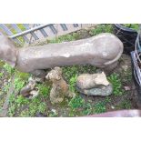 FOUR ANIMAL FIGURE GARDEN ORNAMENTS including a plastic Dachshund seat 115cm long, a composite Boxer