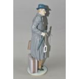 A LLADRO 'ON THE ROAD' FIGURE, depicting a man with suitcase, briefcase and umbrella, no 5681,