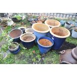 TEN BLUE GLAZED PLANT POTS including a pair in light blue 48cm in diameter and 49cm high (
