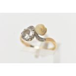 AN EARLY 20TH CENTURY 18CT GOLD DIAMOND AND PEARL DRESS RING, of crossover design, set with an early