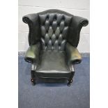 A GREEN LEATHER WINCHESTER FUNITURE BUTTONED WING BACK ARMCHAIR, on cabriole legs, width 84cm x