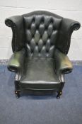 A GREEN LEATHER WINCHESTER FUNITURE BUTTONED WING BACK ARMCHAIR, on cabriole legs, width 84cm x