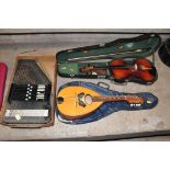 THREE STRINGED MUSICAL INSTRUMENTS comprising of a Schengrin Autoharp in half its original box, a