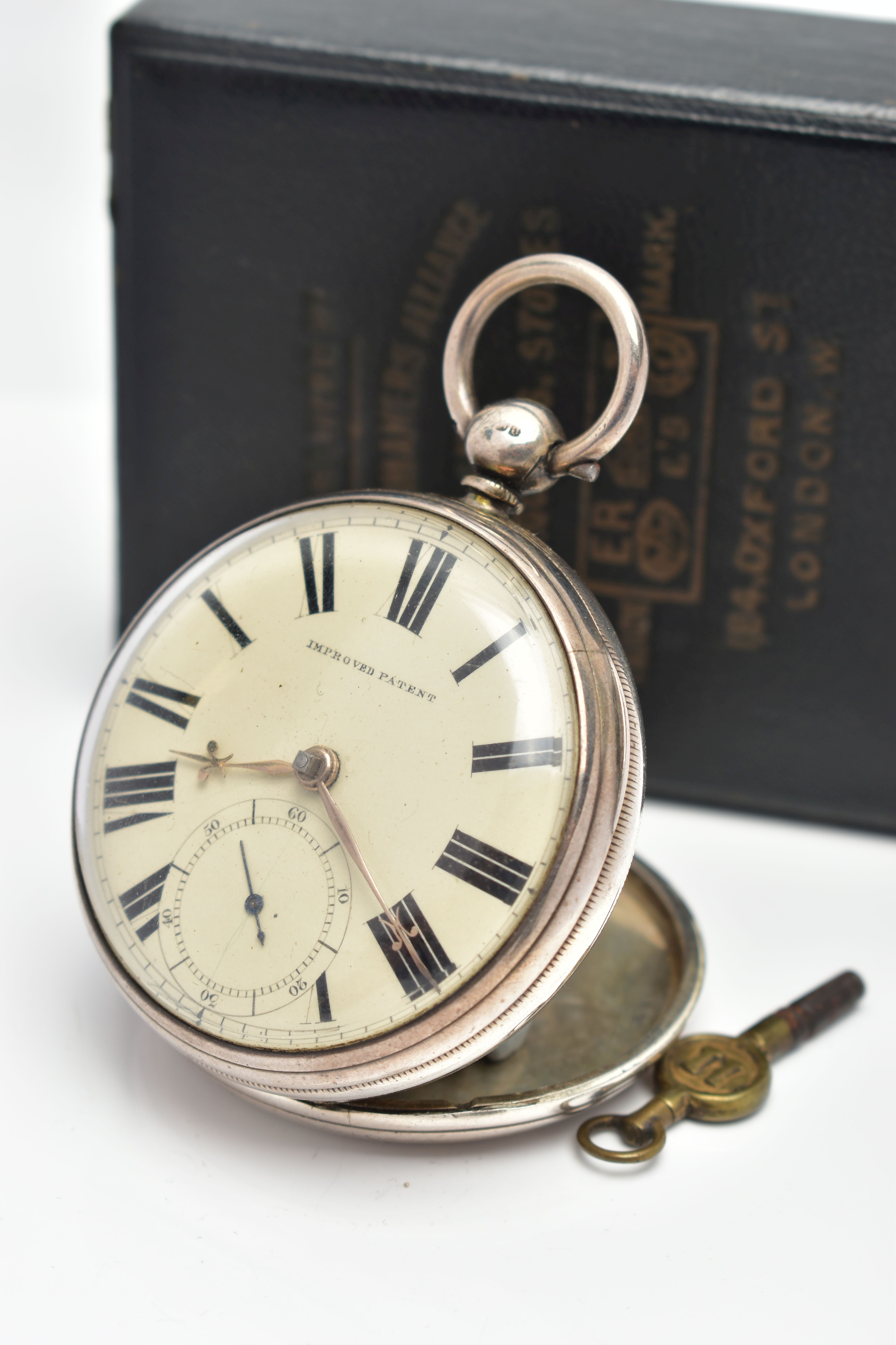 A CASED SILVER OPEN FACE POCKET WATCH, key wound, round cream dial signed 'Improved Patent', large - Image 2 of 8