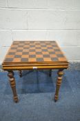 A MAHOGANY GAMES PLAYING TABLE, including chess and backgammon piece, 51cm cubed