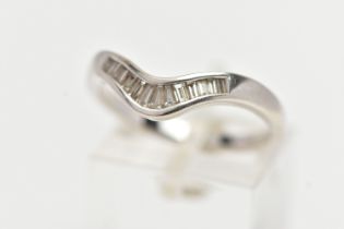 AN 18CT WHITE GOLD DIAMOND WISHBONE RING, half eternity set with tapered baguette cut diamonds, to a