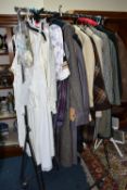 A QUANTITY OF VINTAGE LADIES' CLOTHING, to include twelve coats, mainly thick woollen examples, a