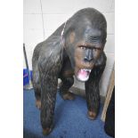 A LIFESIZE COMPOSITION MODEL OF A SILVERBACK GORILLA, height 129cm (condition:-good condition)