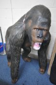 A LIFESIZE COMPOSITION MODEL OF A SILVERBACK GORILLA, height 129cm (condition:-good condition)