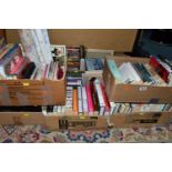 BOOKS, seven boxes containing approximately 110 book titles in hardback and paperback format and a