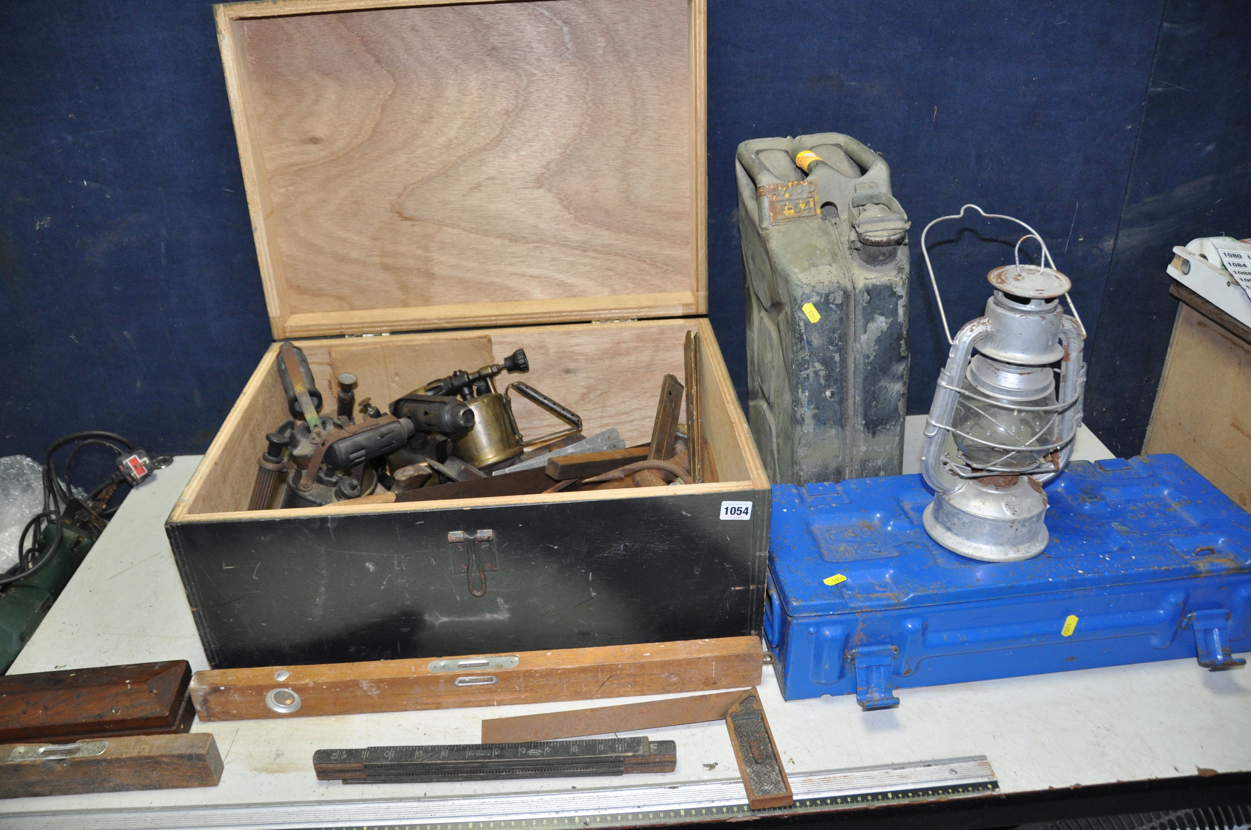 A WOODEN TOOLBOX CONTAINING TOOLS, including four Brass blow lamps by Max Sievert, Veritas and