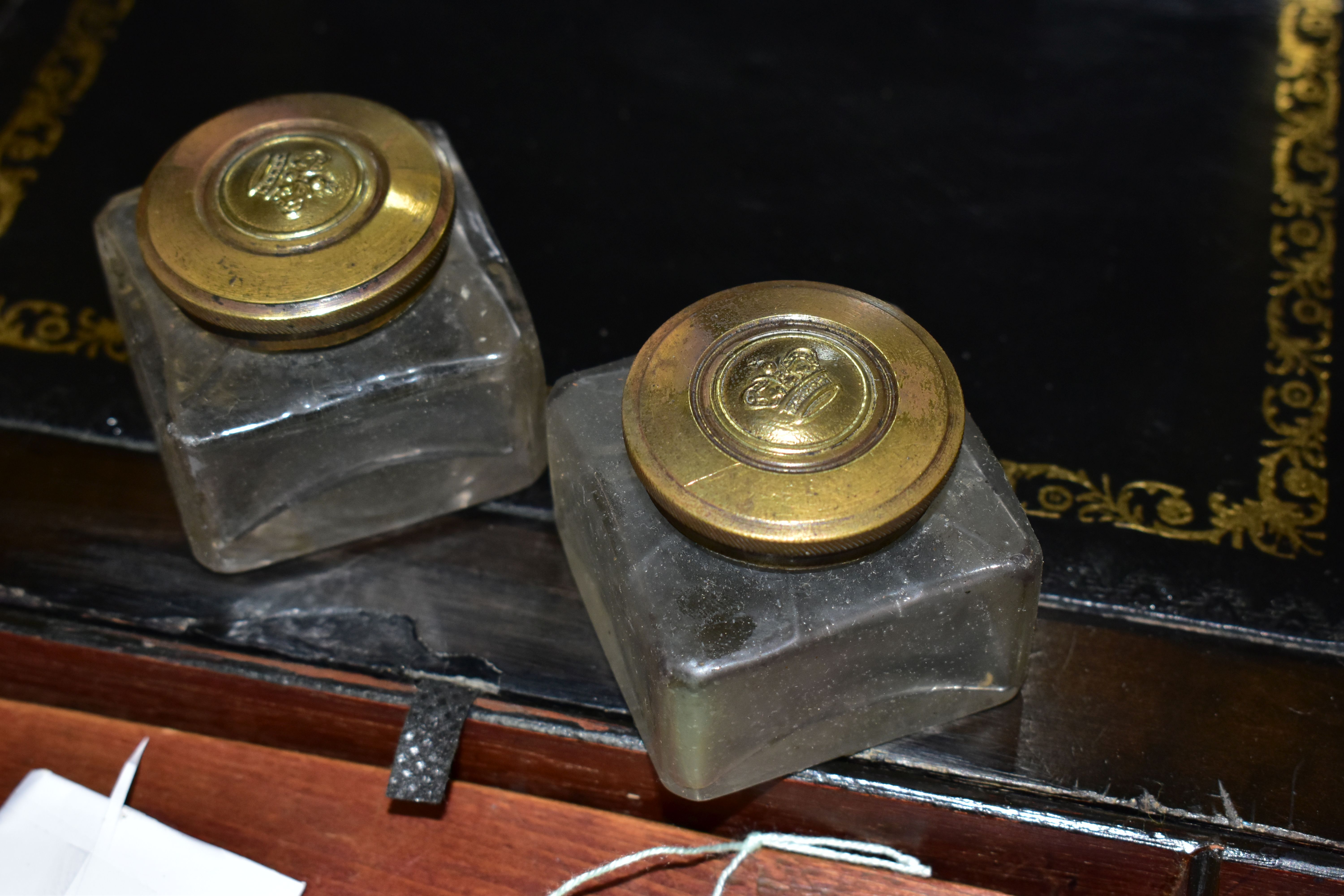 A REGENCY ROSEWOOD TEA CADDY AND TWO WRITING SLOPES, the tea caddy of sarcophagus form supported - Image 4 of 9