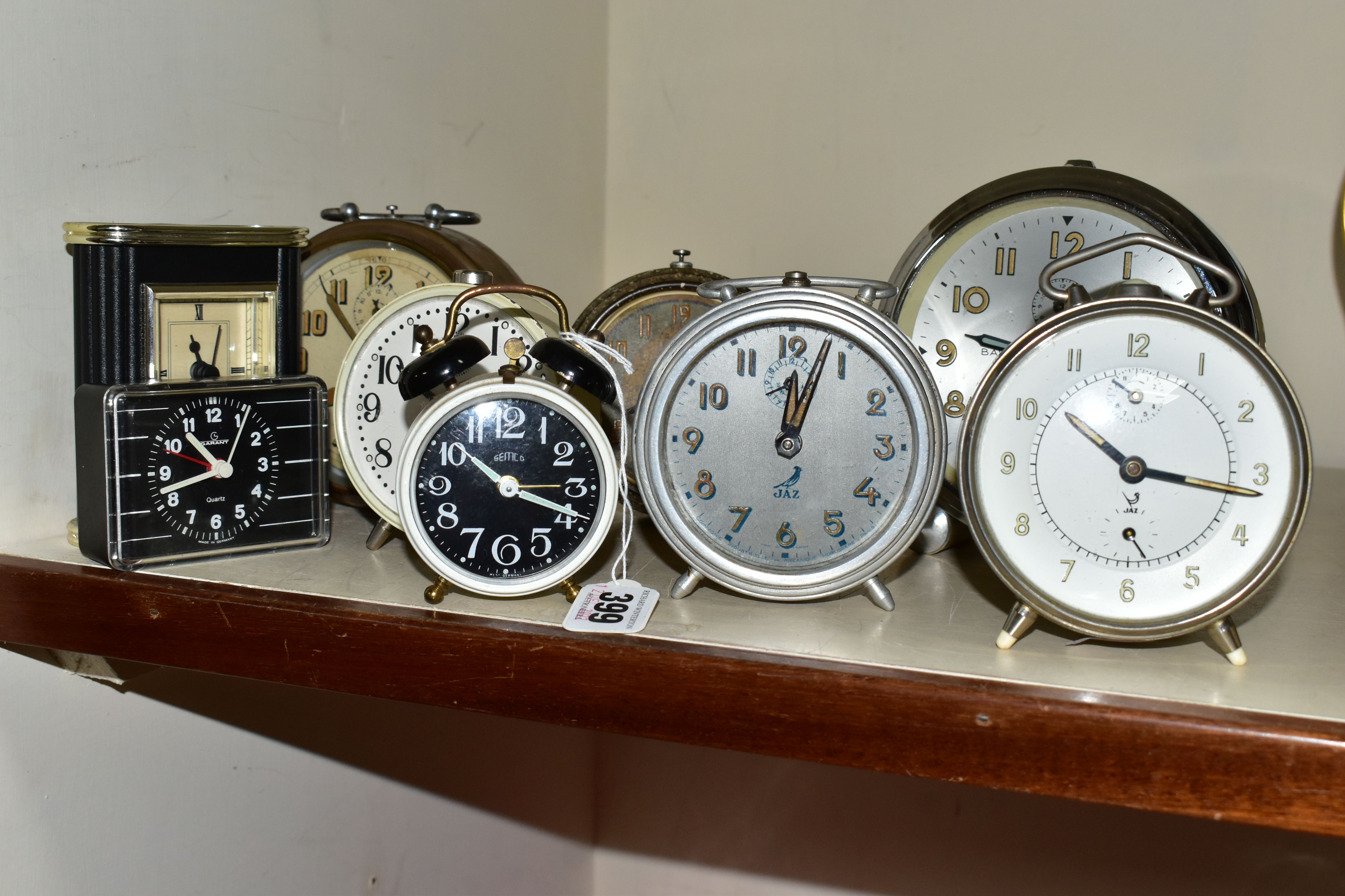 A COLLECTION OF NINE VINTAGE BEDSIDE ALARM CLOCKS, comprising three Jaz French alarm clocks, an