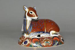 A ROYAL CROWN DERBY DEER PAPERWEIGHT, the first to be designed and manufactured as an exclusive