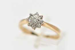 A 9CT YELLOW GOLD DIAMOND CLUSTER RING, of a flower shape, set with nine round brilliant cut