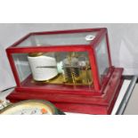 A MODERN CASED BAROGRAPH, the case having a mahogany stained finish, with lift off glass top, and