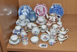 A COLLECTION OF ASSORTED MINIATURE TEAWARES, comprising a Wedgwood blue Jasper Ware coffee pot, a