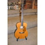 A JOHNSON GUITARS J016 ACOUSTIC GUITAR with a solid Spruce top, mahogany back and sides, Rosewood