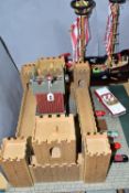 AN EARLY LEARNING CENTRE CASTLE AND PIRATE SHIP, the castle on baseboard measuring 62cm x 61cm,