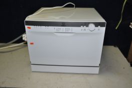 AN INDESIT TABLE TOP DISHWASHER, width 55cm x depth 51cm x height 44cm (PAT pass and working)