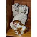 A FISCHER AND MIEG FIGURE OF A SEATED SPANIEL AND A LARGE PAIR OF SADLER STAFFORDSHIRE SPANIELS, the