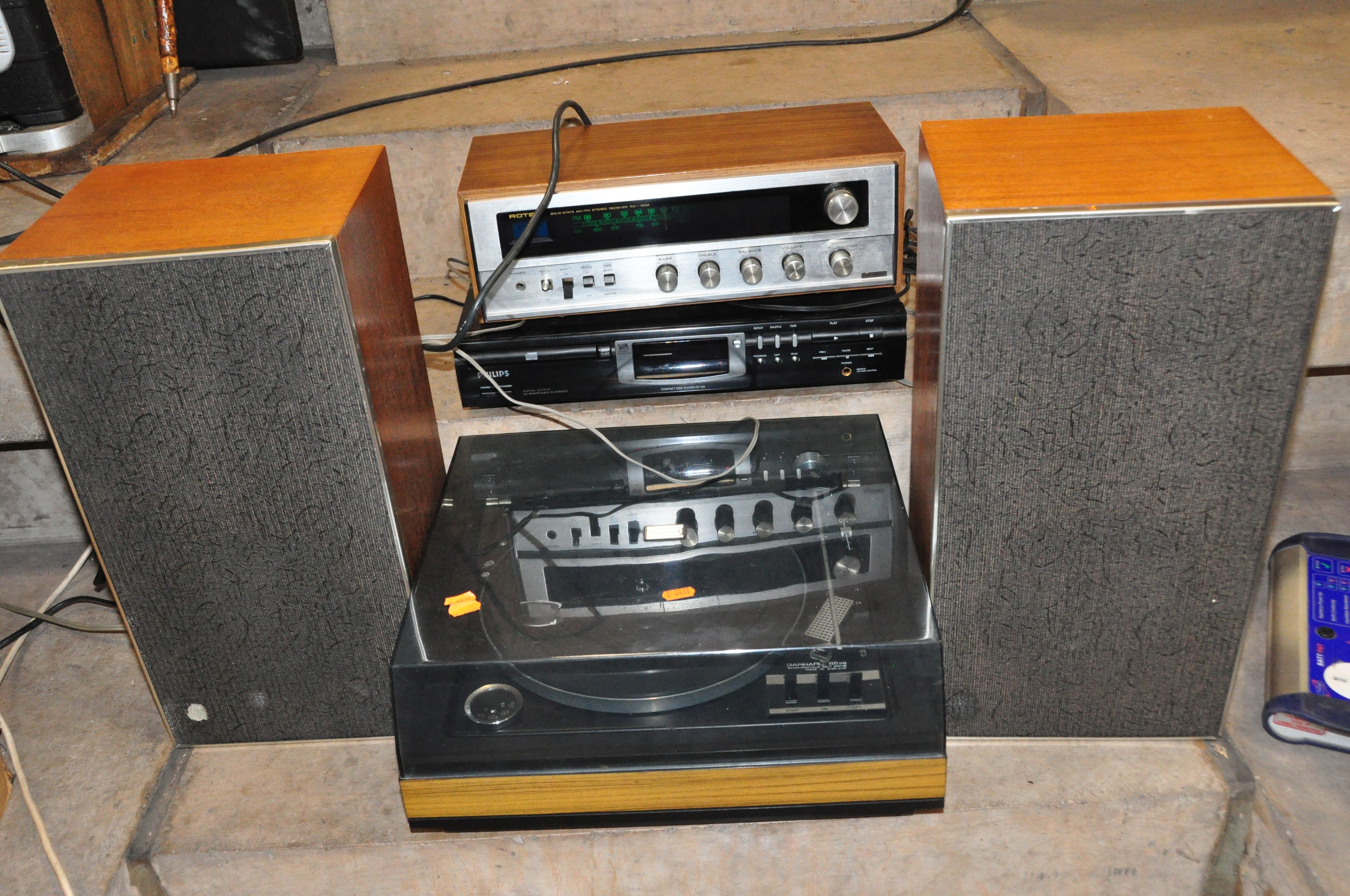 A ROTEL RX-150A VINTAGE STEREO RECEIVER with a walnut effect covering, a Garrard 86SB turntable, a