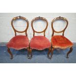 THREE VICTORIAN WALNUT BALLOON BACK CHAIRS, with foliate carving to top (condition - ideal for