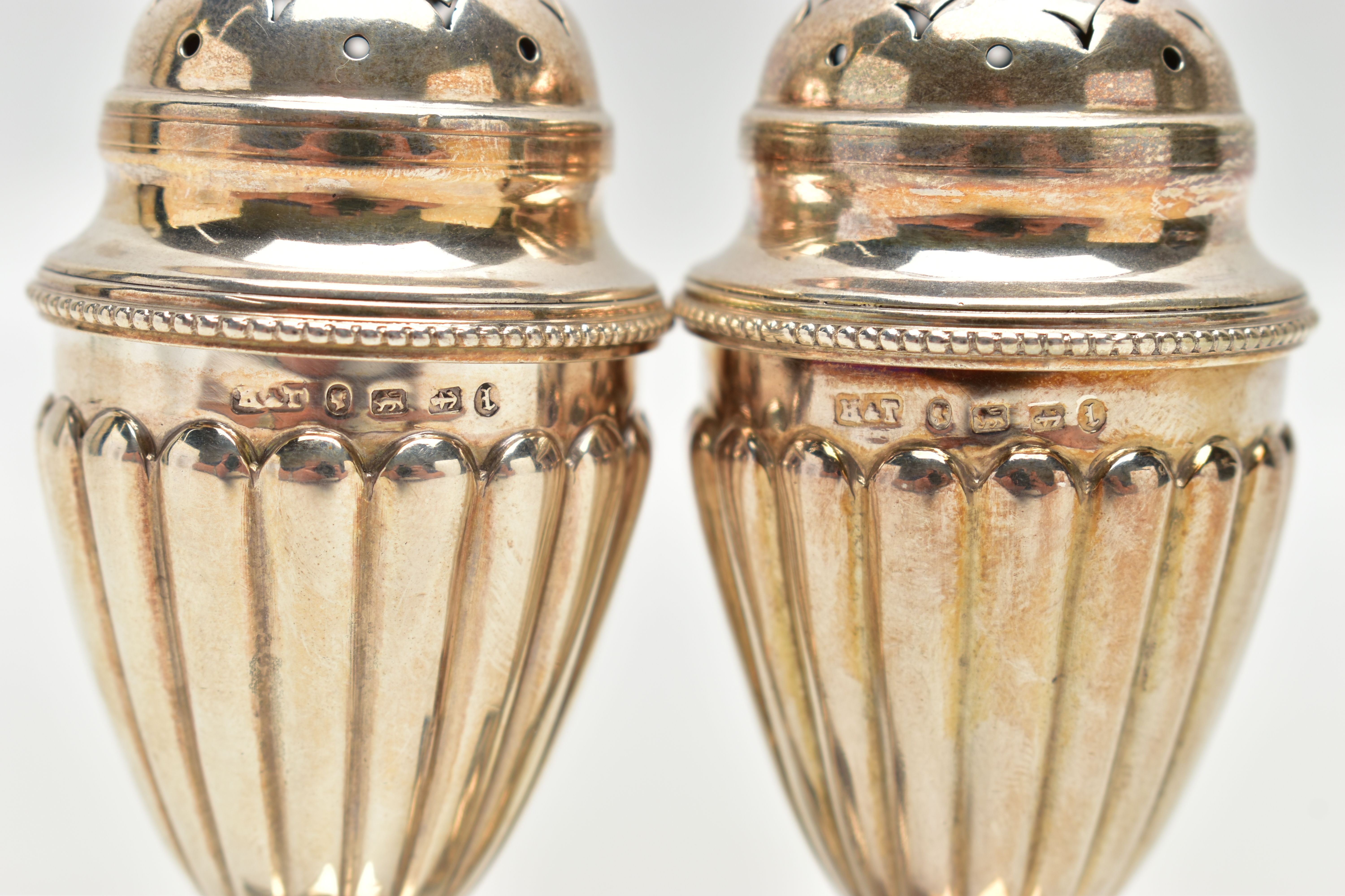 A PAIR OF VICTORIAN SILVER PEPPERETTES, each of a tapering form, stop reeded design, on weighted - Image 3 of 3