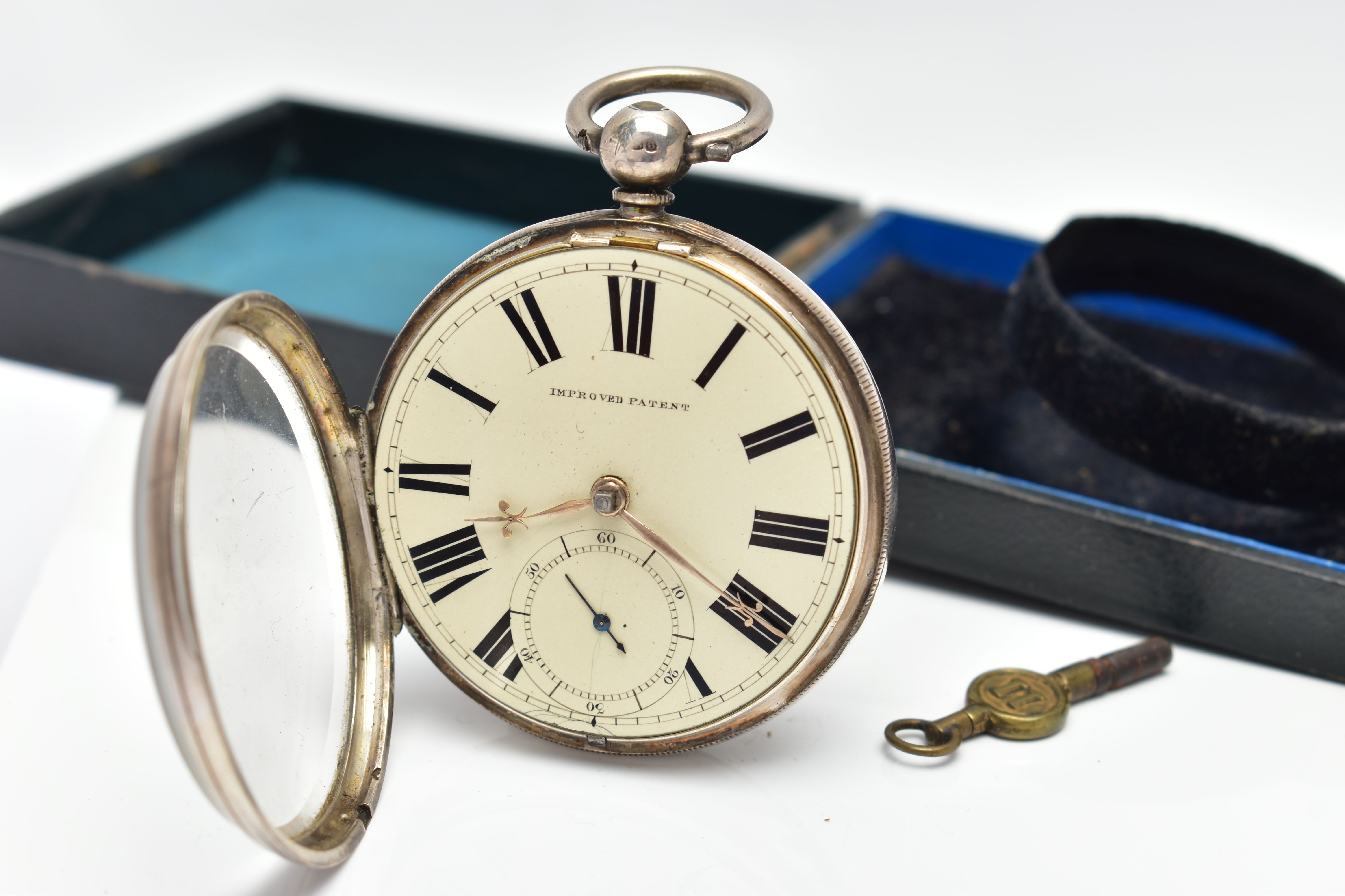 A CASED SILVER OPEN FACE POCKET WATCH, key wound, round cream dial signed 'Improved Patent', large - Image 5 of 8