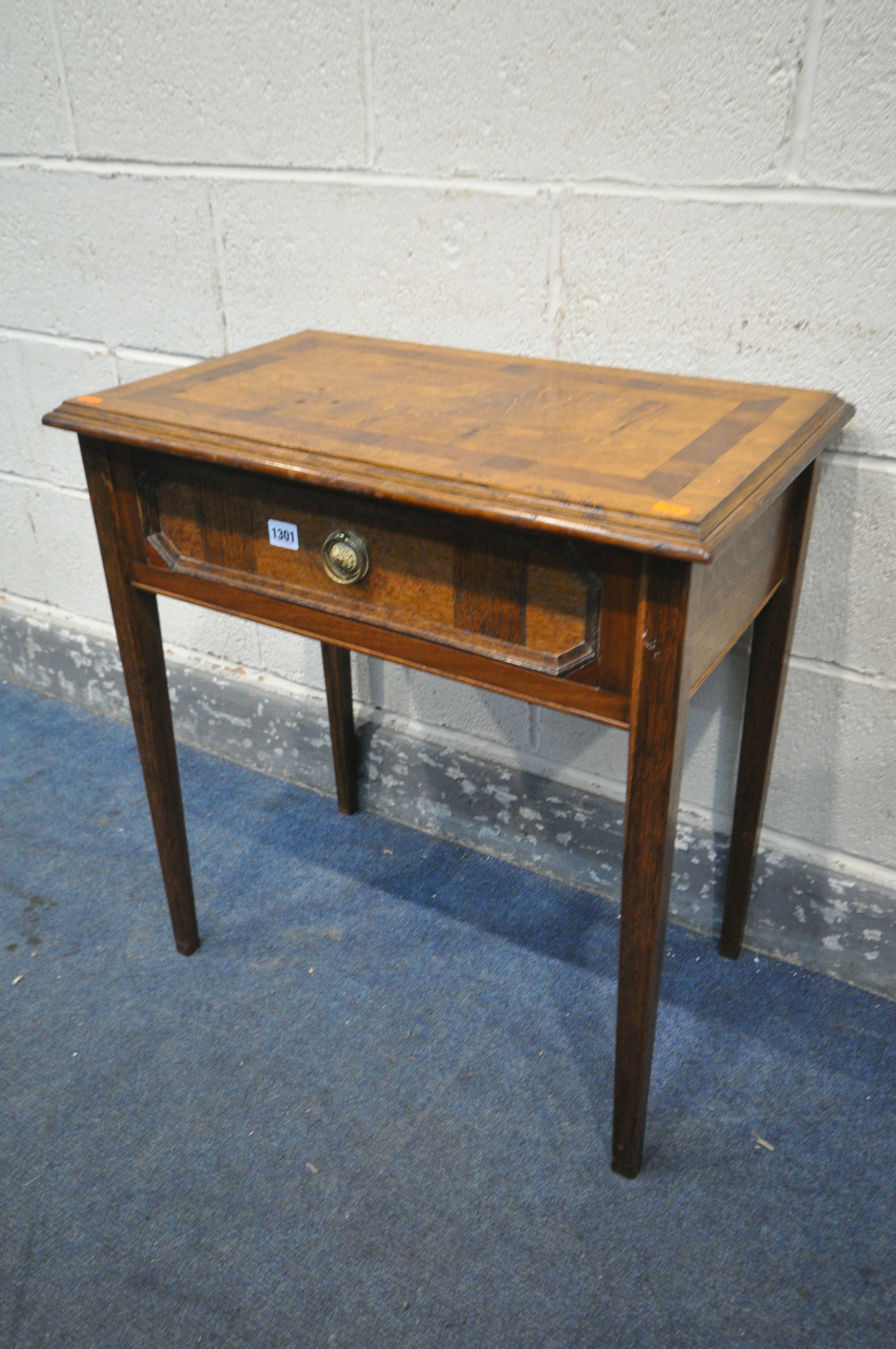 A REPRODUCTION OAK SIDE TABLE, with a single drawer, on square tapered legs, length 64cm x depth