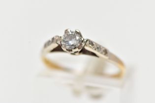 A YELLOW METAL SINGLE STONE DIAMOND RING, designed with a single claw set, round brilliant cut