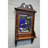 AN EDWARDIAN MAHOGANY AND TURNIDGEWARE BEVELLED EDGE WALL MIRROR, with a single shelf, 77cm x 67cm